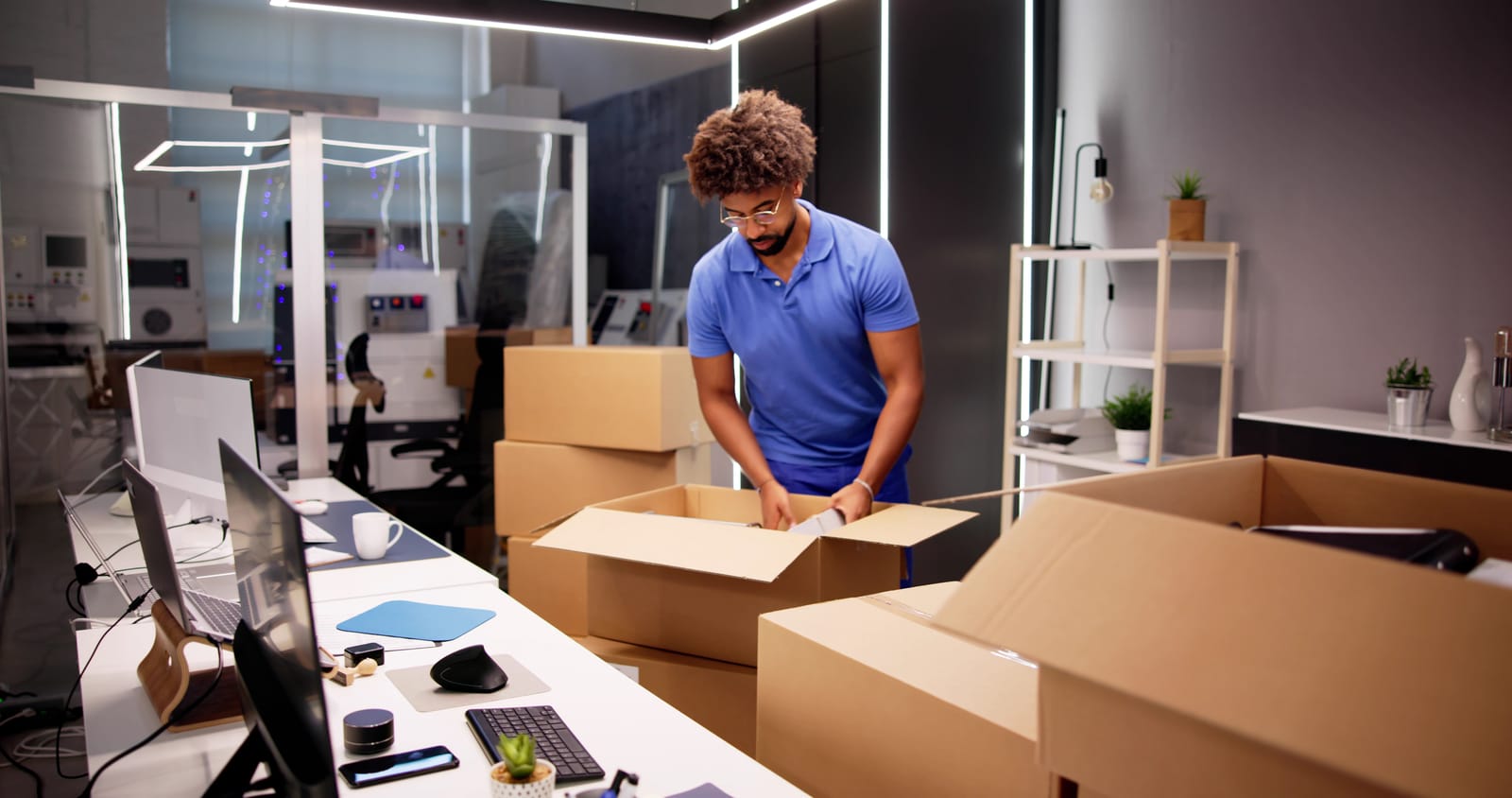 89896914-professional-movers-packing-boxes